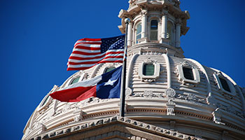 Texas capital with flags waving